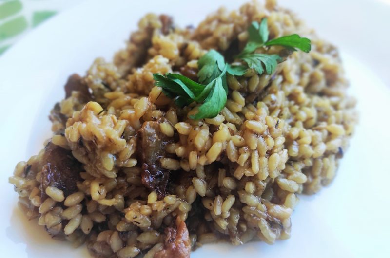 Arroz con secreto ibérico, champiñones y parmesano.